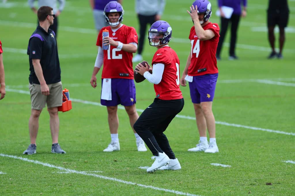 Quarterbacks J.J. McCarthy #9, Sam Darnold #14 and Nick Mullens #12 of the Minnesota Vikings watch the drill during Minnesota Vikings mandatory minicamp at Twin Cities Orthopedics Performance Center on June 04, 2024 in Eagan, Minnesota.