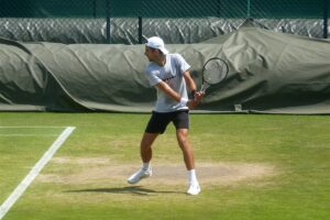 Djokovic practicing at Wimbledon, not ruling out participation