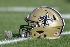 New Orleans Saints helmet rests on the field prior to an NFL game between the New Orleans Saints and the Tampa Bay Buccaneers on December 31, 2017, at Raymond James Stadium in Tampa, FL.