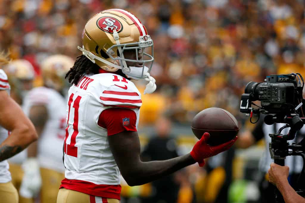 Brandon Aiyuk #11 of the San Francisco 49ers reacts after catching a touchdown in the first quarter against the Pittsburgh Steelers at Acrisure Stadium on September 10, 2023 in Pittsburgh, Pennsylvania.