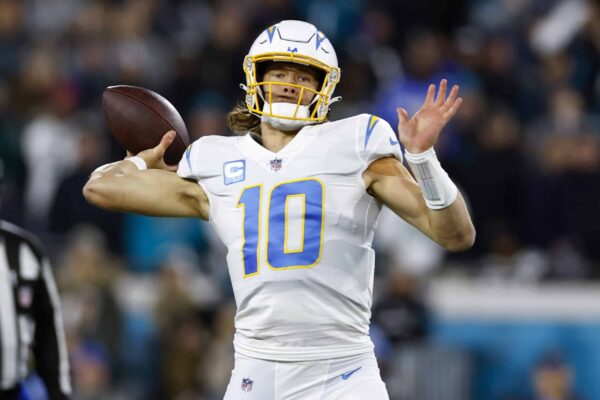 Justin Herbert #10 of the Los Angeles Chargers throws a pass against the Jacksonville Jaguars during the first half of the game in the AFC Wild Card playoff game at TIAA Bank Field on January 14, 2023 in Jacksonville, Florida.