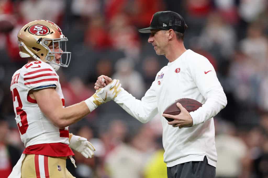Head coach Kyle Shanahan of the San Francisco 49ers interacts with Christian McCaffrey #23 prior to Super Bowl LVIII against the Kansas City Chiefs at Allegiant Stadium on February 11, 2024 in Las Vegas, Nevada.