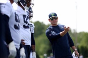 Head coach Mike Macdonald of the Seattle Seahawks watches a workout during Seattle Seahawks rookie minicamp at Virginia Mason Athletic Center on May 03, 2024 in Renton, Washington.