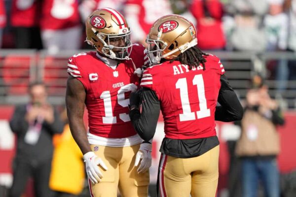 Deebo Samuel #19 of the San Francisco 49ers celebrates a touchdown with Brandon Aiyuk #11 during the second quarter in the game against the Seattle Seahawks at Levi