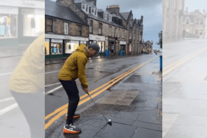 Golfer hits shot into 18th green at St. Andrews from a street over