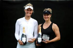 Erin Routliffe and Gabriela Dabrowski (right) hold their Nottingham trophies. Dabrowski and Bianca Andreescu both reached finals on grass.