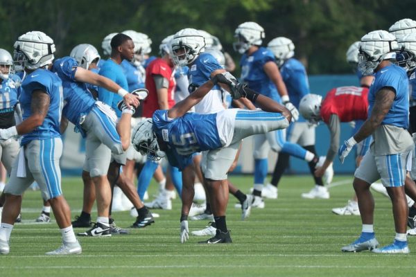 Detroit Lions players stretch before the start of training camp at team headquarers in Allen Park on Friday, July 28, 2023.