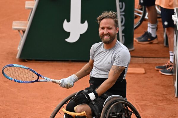 Rob Shaw smiles during his wheelchair singles match at the French Open. He will be competing at the Paralympics in July.