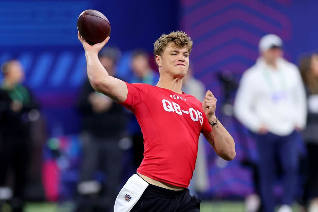 J J McCarthy #QB05 of Michigan participates in a drill during the NFL Combine at Lucas Oil Stadium on March 02, 2024 in Indianapolis, Indiana.