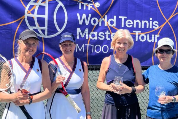 Four Canadians pose with their trophies at the ITF Masters event in Ottawa.