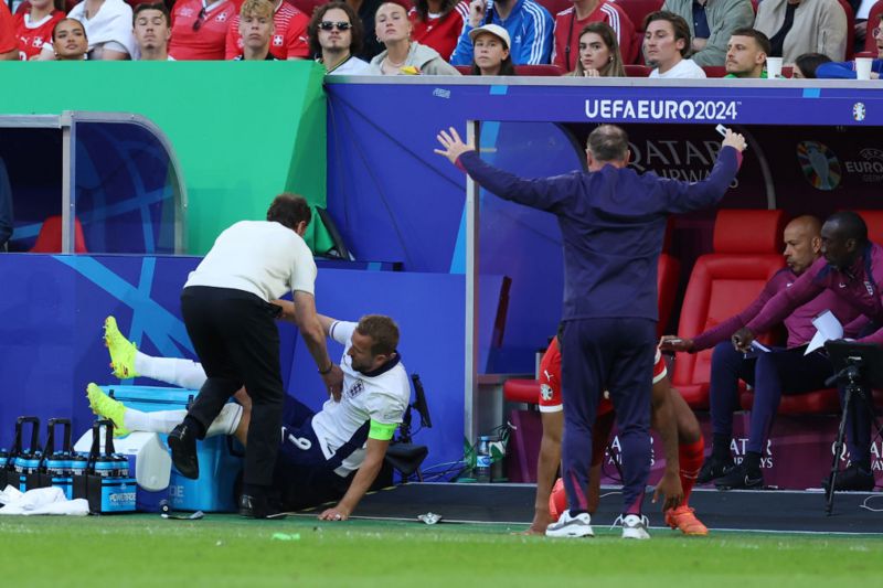 Video: Harry Kane hauled off amid injury fears after bizarrely crashing into Gareth Southgate during England's clash with Switzerland