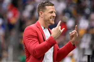 Former Houston Texans player J.J. Watt waves to the crowd during a ceremony inducting him into the Texans Ring of Honor during a game against the Pittsburgh Steelers at NRG Stadium on October 01, 2023 in Houston, Texas.