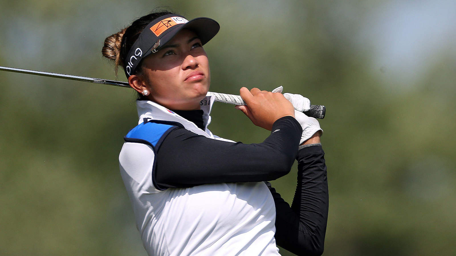 WATCH: One-in-a-million: errant golf shot lodges in spectator's arm