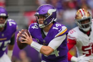 Minnesota Vikings quarterback Sam Darnold (14) scrambles against the San Francisco 49ers in the first quarter at U.S. Bank Stadium.
