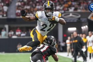 Pittsburgh Steelers running back Najee Harris (22) jumps over Atlanta Falcons cornerback Mike Hughes (21) at Mercedes-Benz Stadium. Should you start Najee Harris in fantasy?