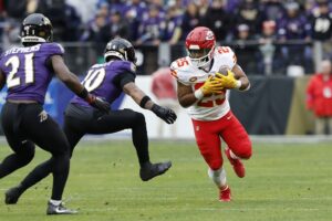 Kansas City Chiefs running back Clyde Edwards-Helaire (25) carries the ball as Baltimore Ravens cornerback Arthur Maulet (10) defends during the first half in the AFC Championship football game at M&T Bank Stadium. Mandatory Credit: Geoff Burke-USA TODAY Sports