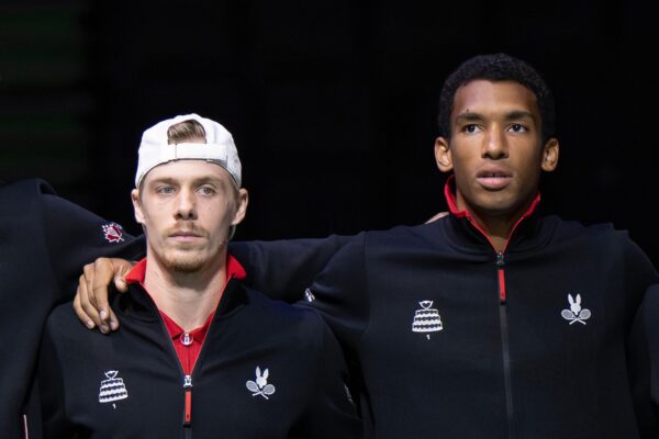 Denis Shapovalov and Felix Auger-Aliassime stand together during the national anthem at the Davis Cup.