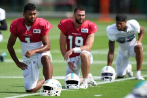 Miami Dolphins quarterback Tua Tagovailoa (1) and quarterback Skylar Thompson (19) stretch during training camp at Baptist Health Training Complex. Mandatory Credit: Jasen Vinlove-USA TODAY Sports