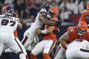 Houston Texans defensive end Danielle Hunter (55) tackles Chicago Bears quarterback Caleb Williams (18) during the fourth quarter at NRG Stadium. Mandatory Credit: Troy Taormina-Imagn Images