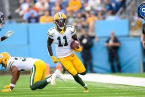 Sep 22, 2024; Nashville, Tennessee, USA; Green Bay Packers wide receiver Jayden Reed (11) runs the ball after.made catch against the Tennessee Titans during the first half at Nissan Stadium. Mandatory Credit: Steve Roberts-Imagn Images