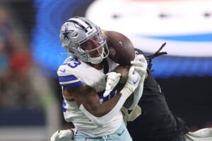 New Orleans Saints linebacker Demario Davis (56) defends a pass against Dallas Cowboys running back Rico Dowdle (23) in the first quarter at AT&T Stadium.