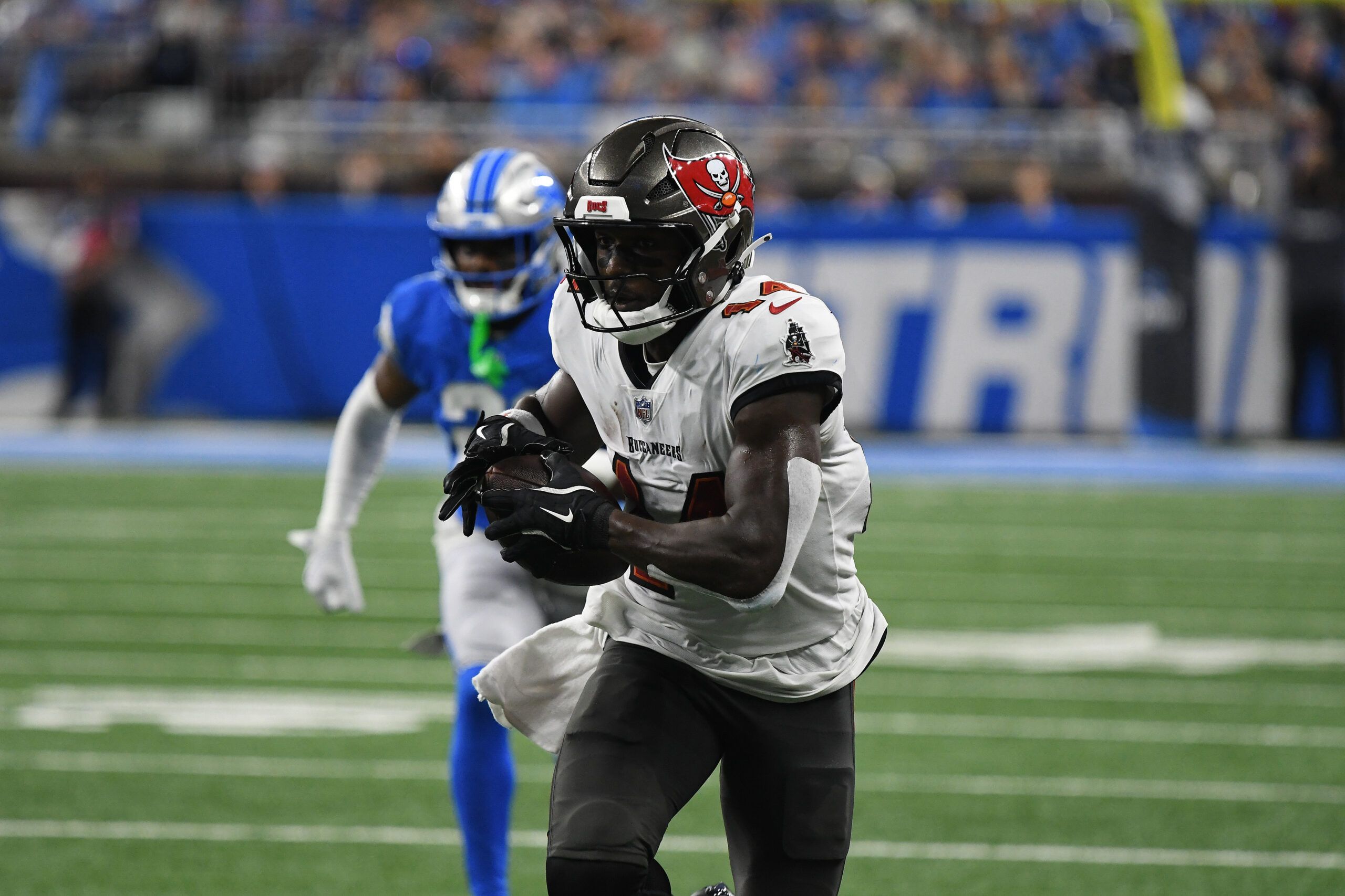 Sep 15, 2024; Detroit, Michigan, USA; Tampa Bay Buccaneers wide receiver Chris Godwin (14) scores a touchdown against the Detroit Lions in the second quarter at Ford Field. Mandatory Credit: Eamon Horwedel-Imagn Images