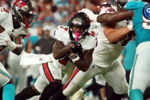 Aug 23, 2024; Tampa, Florida, USA; Tampa Bay Buccaneers running back Bucky Irving (7) runs with the ball against the Miami Dolphins during the second quarter at Raymond James Stadium. Mandatory Credit: Kim Klement Neitzel-USA TODAY Sports