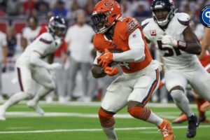 Chicago Bears running back D'Andre Swift (4) rushes against Houston Texans defensive end Will Anderson Jr. (51) in the first quarter at NRG Stadium.