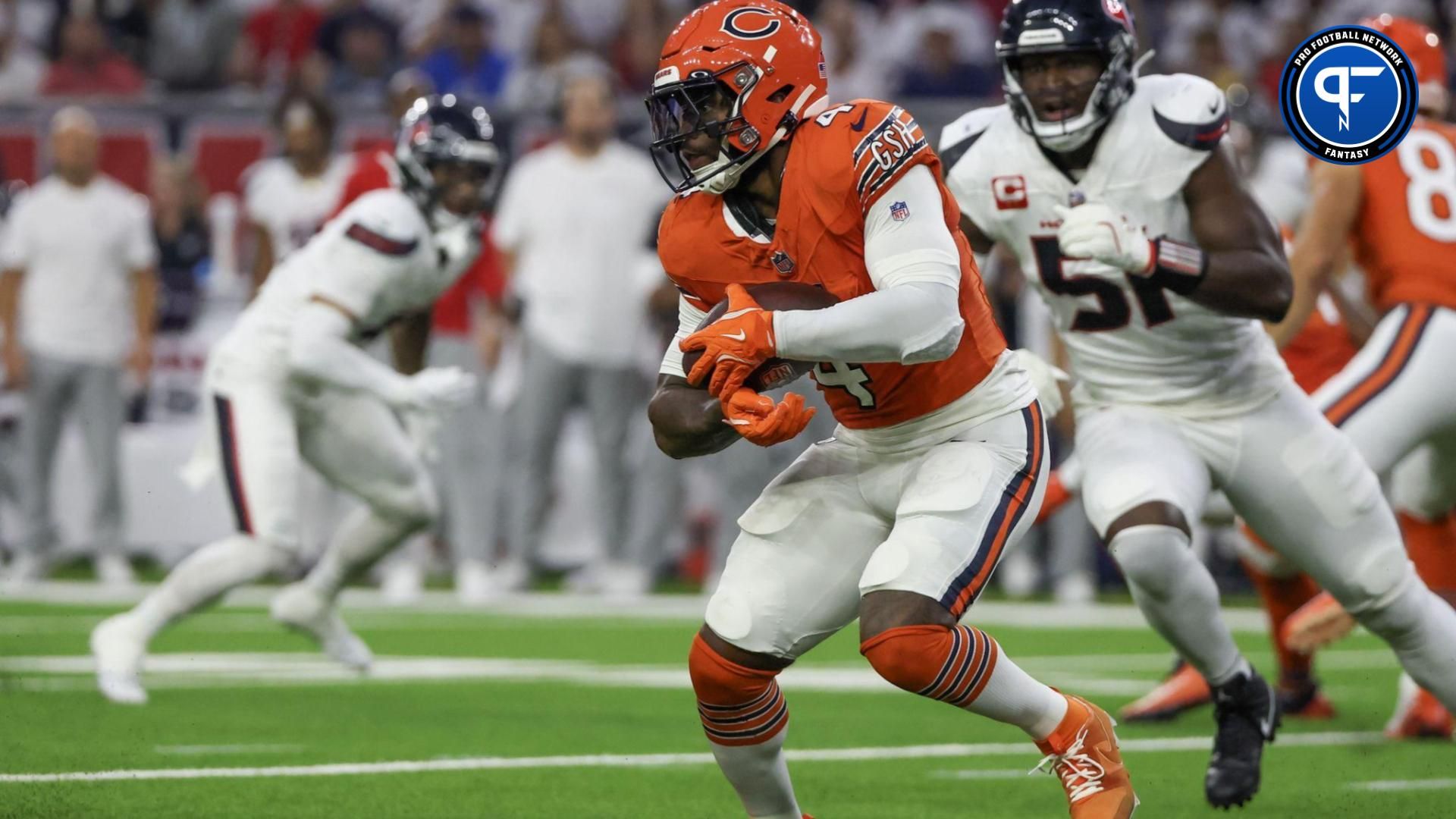 Chicago Bears running back D'Andre Swift (4) rushes against Houston Texans defensive end Will Anderson Jr. (51) in the first quarter at NRG Stadium.