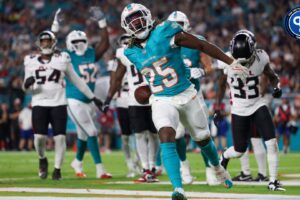 Miami Dolphins running back Jaylen Wright (25) celebrates after scoring a touchdown against the Atlanta Falcons in the second quarter during preseason at Hard Rock Stadium.