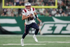 New England Patriots quarterback Drake Maye (10) runs with the ball against the New York Jets during the fourth quarter at MetLife Stadium. Mandatory Credit: Brad Penner-Imagn Images