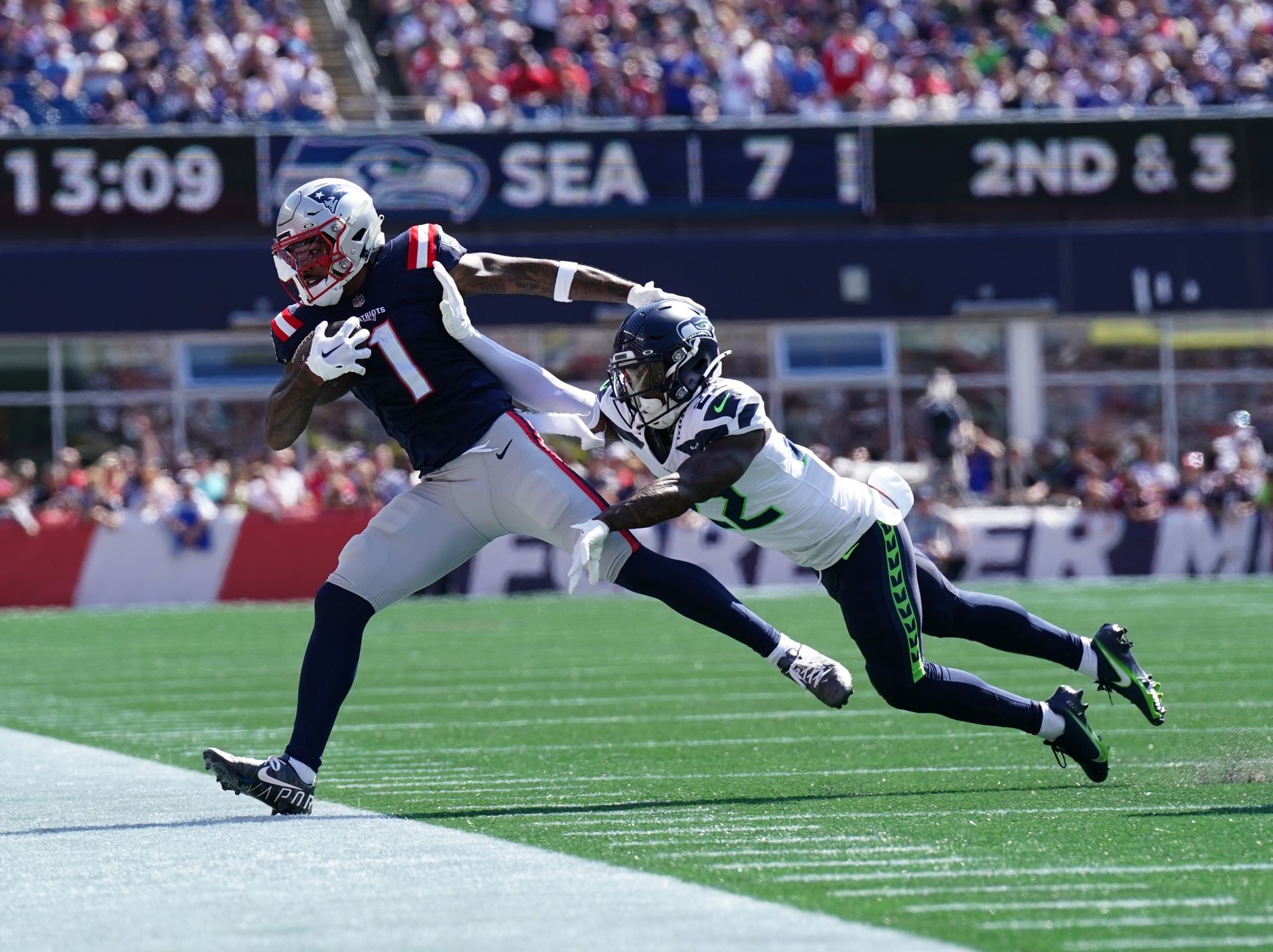 New England Patriots wide receiver Ja'Lynn Polk (1) is pushed out of bounds by Seattle Seahawks cornerback Tre Brown (22) in the second quarter at Gillette Stadium.