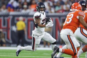 Sep 15, 2024; Houston, Texas, USA; Houston Texans running back Joe Mixon (28) runs with the ball during the first quarter against the Chicago Bears at NRG Stadium. Mandatory Credit: Troy Taormina-Imagn Images