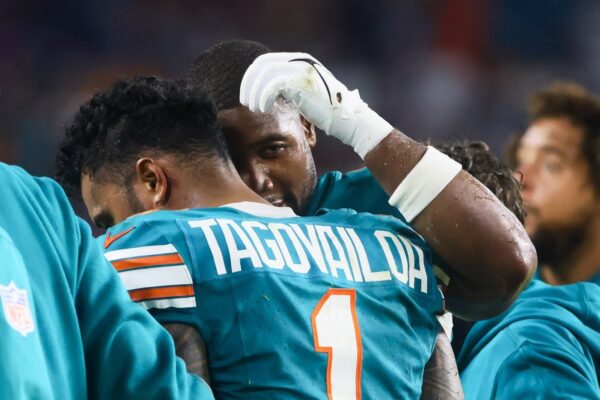 Miami Dolphins quarterback Tua Tagovailoa (1) walks off the field after an apparent injury against the Buffalo Bills during the third quarter at Hard Rock Stadium. Mandatory Credit: Sam Navarro-Imagn Images