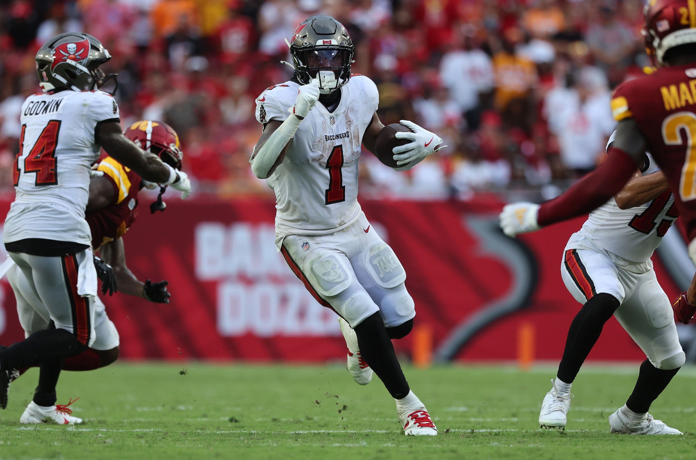 Tampa Bay Buccaneers running back Rachaad White (1) runs with the ball against the Washington Commanders during the second half at Raymond James Stadium.