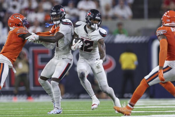 Sep 15, 2024; Houston, Texas, USA; Houston Texans wide receiver Nico Collins (12) runs with the ball after a reception during the fourth quarter against the Chicago Bears at NRG Stadium. Mandatory Credit: Troy Taormina-Imagn Images