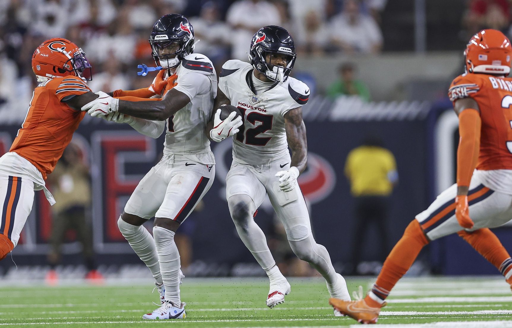 Sep 15, 2024; Houston, Texas, USA; Houston Texans wide receiver Nico Collins (12) runs with the ball after a reception during the fourth quarter against the Chicago Bears at NRG Stadium. Mandatory Credit: Troy Taormina-Imagn Images