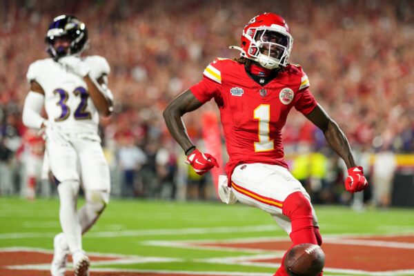 Kansas City Chiefs wide receiver Xavier Worthy (1) scores a touchdown against Baltimore Ravens safety Marcus Williams (32) during the first half at GEHA Field at Arrowhead Stadium. Mandatory Credit: Jay Biggerstaff-Imagn Images