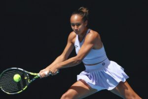 Leylah Fernandez reaches to hit a backhand during her opening Australian Open match.
