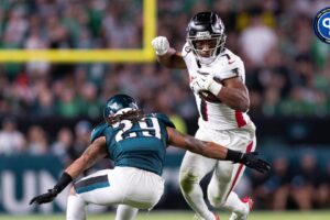 Sep 16, 2024; Philadelphia, Pennsylvania, USA; Atlanta Falcons running back Bijan Robinson (7) avoids the tackle of Philadelphia Eagles cornerback Avonte Maddox (29) during the second quarter at Lincoln Financial Field. Mandatory Credit: Bill Streicher-Imagn Images