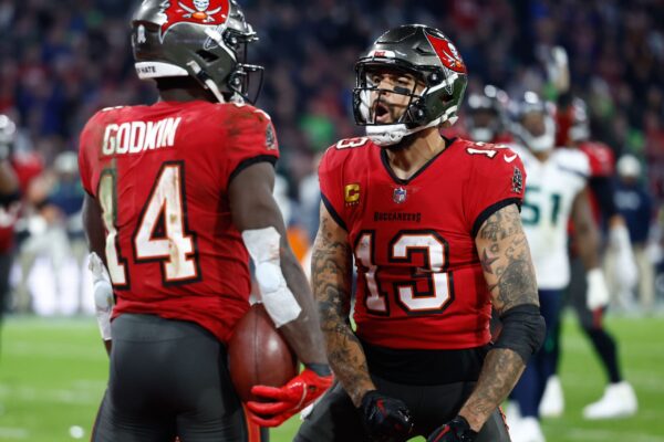 Nov 13, 2022; Munich, Germany, DEU; Tampa Bay Buccaneers wide receiver Chris Godwin (14) celebrates his touchdown with teammate wide receiver Mike Evans (13) against the Seattle Seahawks during the fourth quarter of an International Series game at Allianz Arena. Mandatory Credit: Douglas DeFelice-USA TODAY Sports