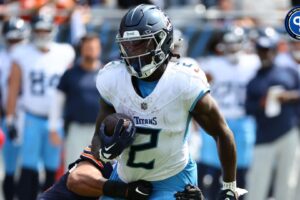 Tennessee Titans running back Tyjae Spears (2) makes a catch against the Chicago Bears during the first quarter at Soldier Field. Mandatory Credit: Mike Dinovo-Imagn Images