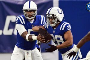 Indianapolis Colts quarterback Anthony Richardson (5) hands the ball off to Indianapolis Colts running back Jonathan Taylor (28) during the first quarter against the Denver Broncos at Lucas Oil Stadium. Where does he sit among our QB fantasy projections?