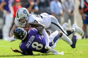 Las Vegas Raiders defensive end Maxx Crosby (98) sacks Baltimore Ravens quarterback Lamar Jackson (8) during the second half at M&T Bank Stadium. Mandatory Credit: Reggie Hildred-Imagn Images
