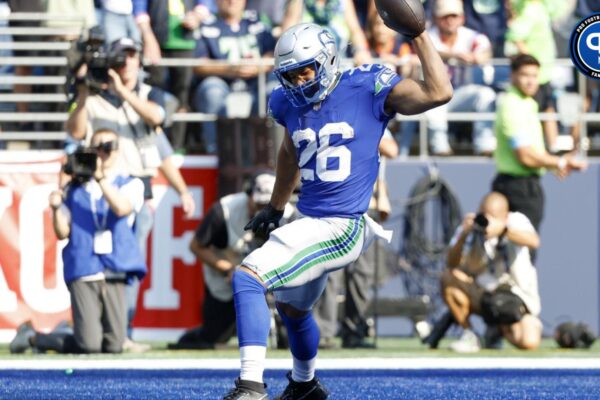 Seattle Seahawks running back Zach Charbonnet (26) celebrates after catching a touchdown pass against the Denver Broncos during the fourth quarter at Lumen Field.