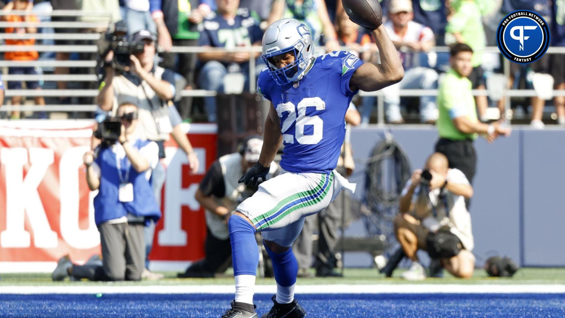 Seattle Seahawks running back Zach Charbonnet (26) celebrates after catching a touchdown pass against the Denver Broncos during the fourth quarter at Lumen Field.