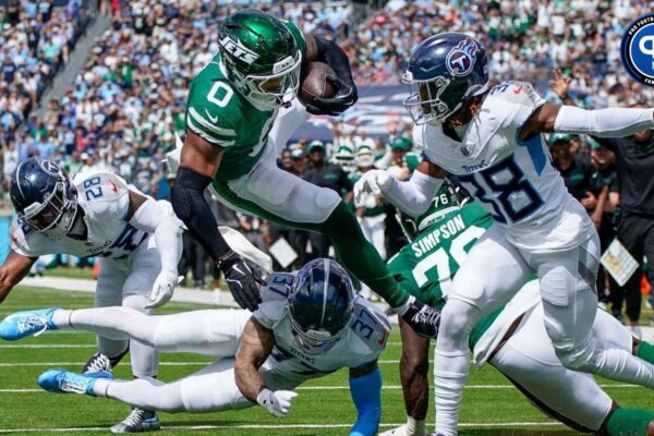 New York Jets running back Braelon Allen (0) leaps past Tennessee Titans safety Amani Hooker (37) and cornerback L'Jarius Sneed (38) for a touchdown during the second quarter at Nissan Stadium in Nashville, Tenn., Sunday, Sept. 15, 2024. Where is Braelon Allen's fantasy standing in Week 3?
