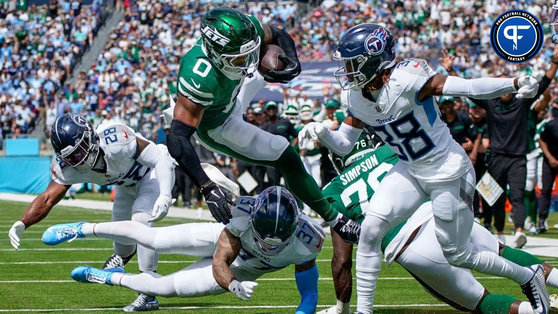 New York Jets running back Braelon Allen (0) leaps past Tennessee Titans safety Amani Hooker (37) and cornerback L'Jarius Sneed (38) for a touchdown during the second quarter at Nissan Stadium in Nashville, Tenn., Sunday, Sept. 15, 2024. Where is Braelon Allen's fantasy standing in Week 3?