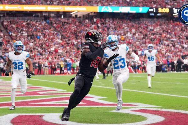 Arizona Cardinals wide receiver Marvin Harrison Jr. (18) catches a touchdown pass against the Detroit Lions during the first half at State Farm Stadium.