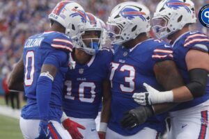 Bills Khalil Shakir is congratulated by teammates Keon Coleman, Dion Dawkins and Spencer Brown on his touchdown catch during the third quarter at Highmark Stadium in Orchard Park on Sept. 8, 2024. Should you start either receiver in fantasy this week?
